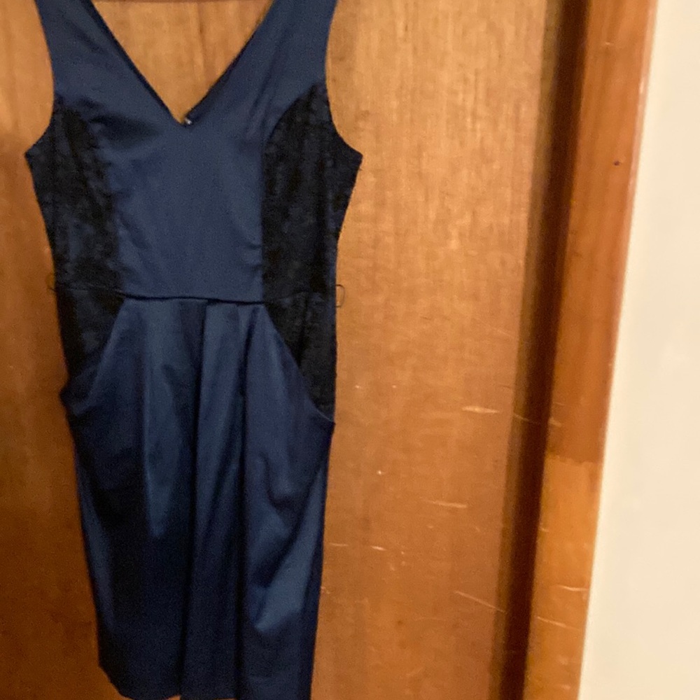 Corey brand sz 8 Navy Satin look,pockets , v neck,black lace inserts on sides.